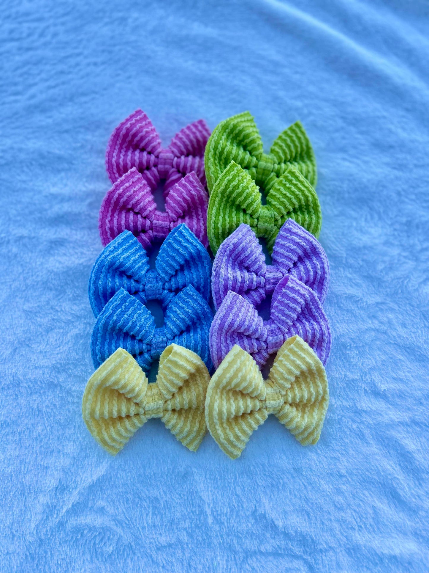 Spring waved rib bows