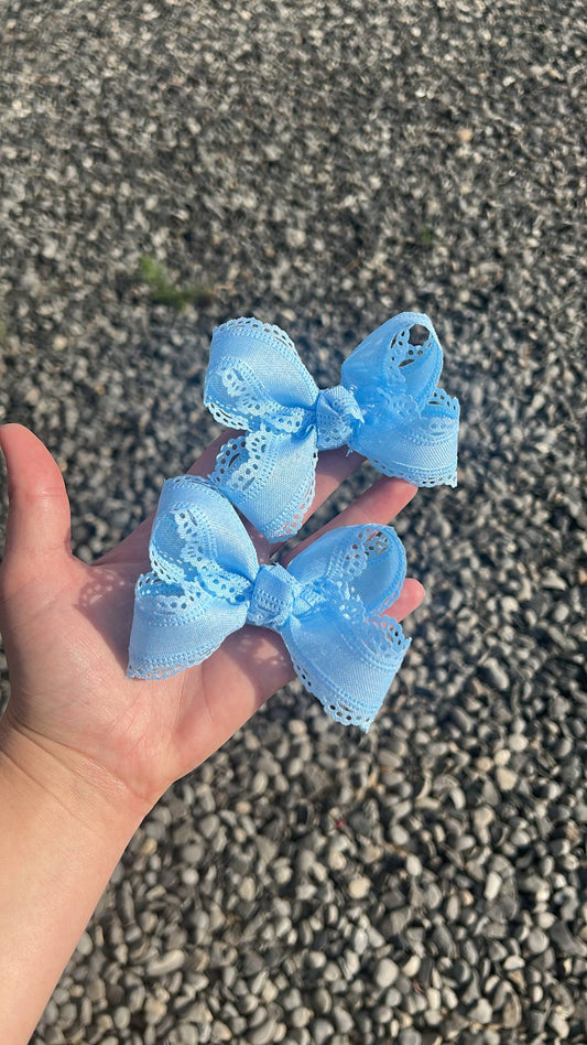 Blue scalloped ribbon bows